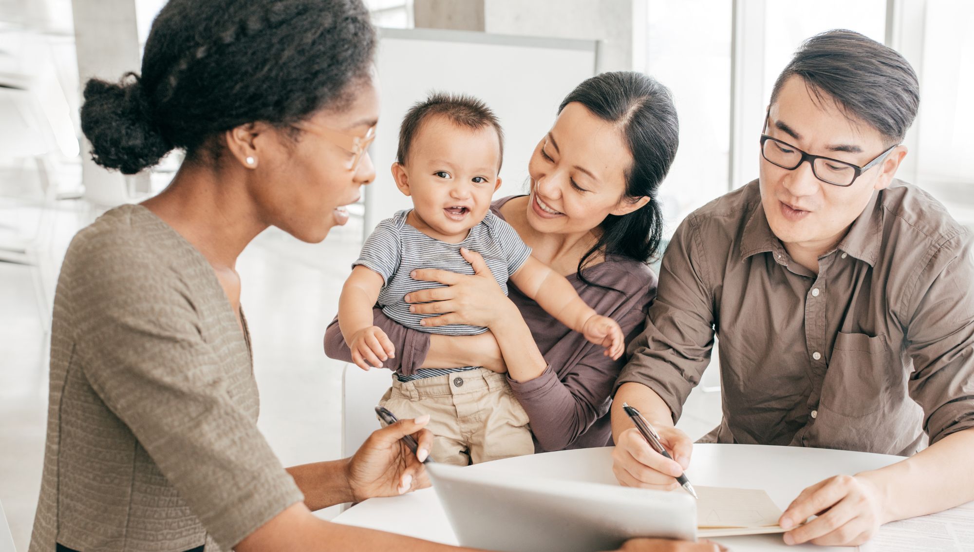 Family working with Loan Officer